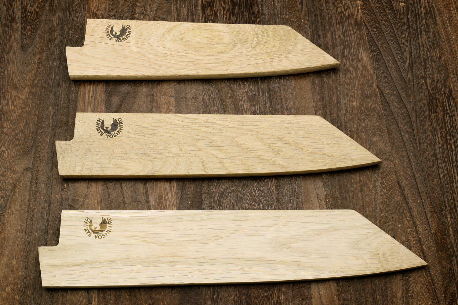 Light oak saya cover with logo, set of three pieces laid flat