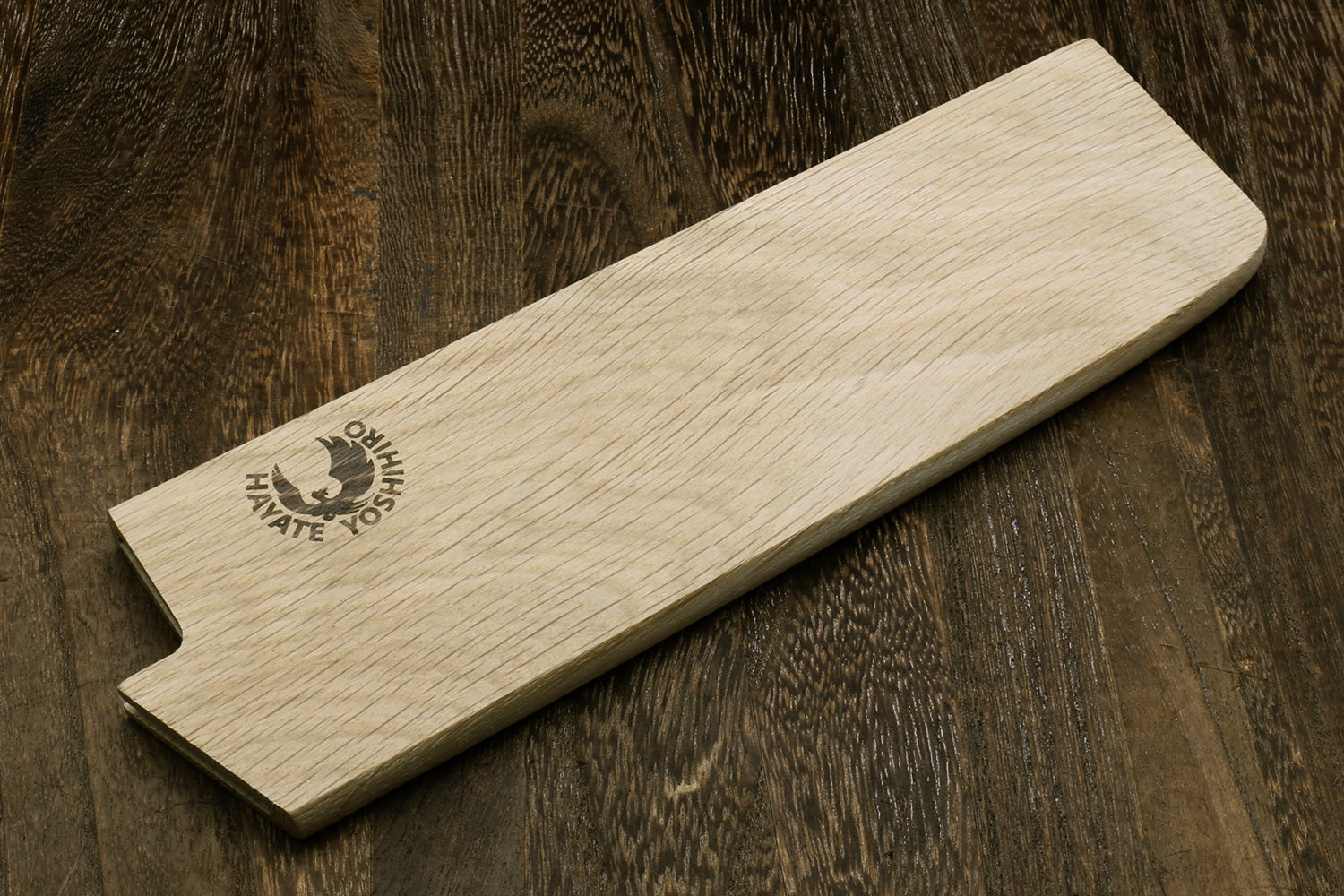 Oak wood saya blade cover with notch cutout and embossed logo, laid flat