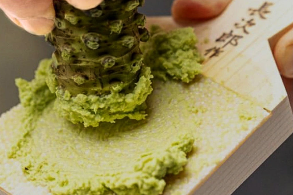 Japanese sharkskin grater with grated wasabi and ginger paste on white surface
