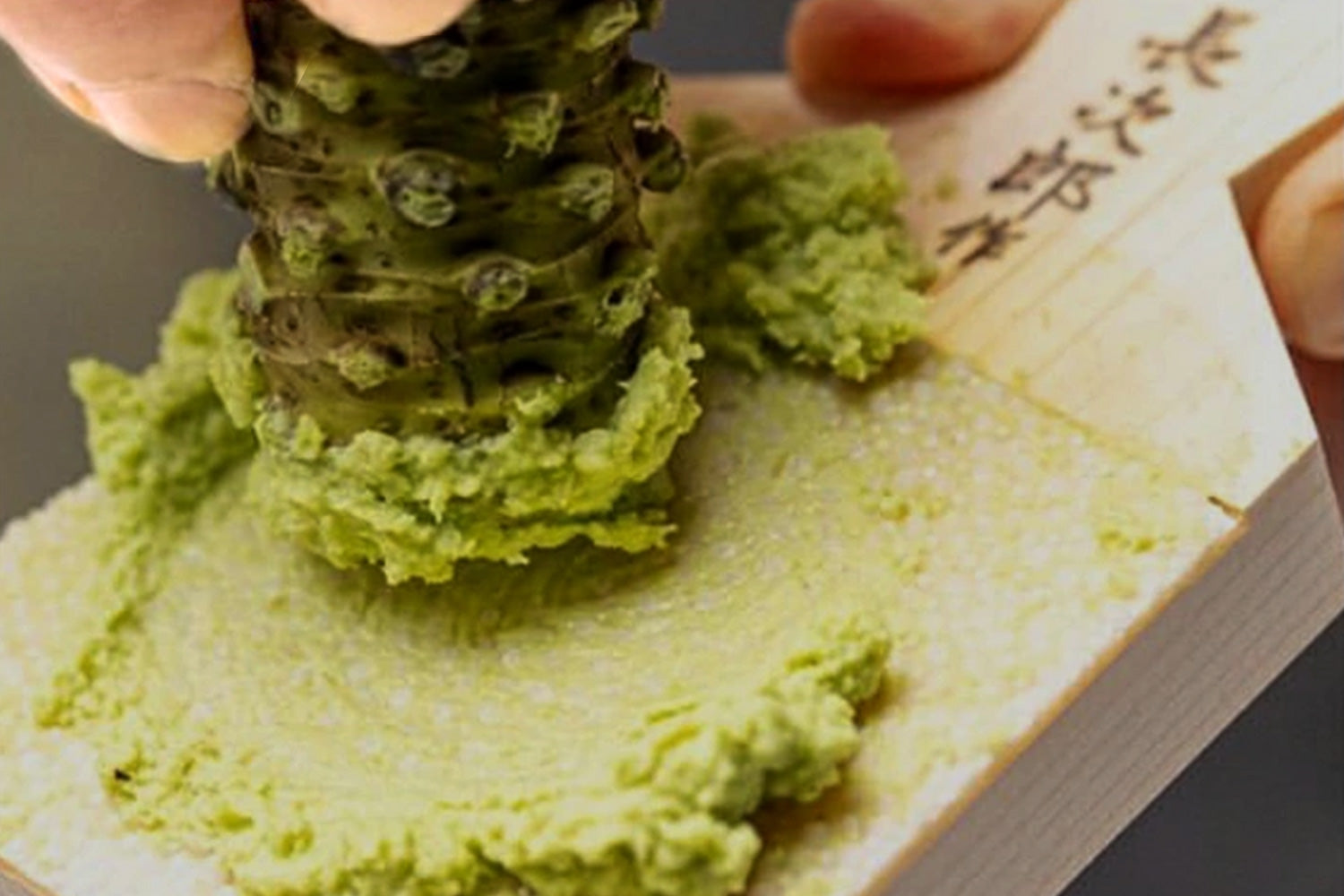 Japanese sharkskin grater with grated wasabi and ginger paste on white surface