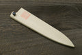 Petty knife blade protector in natural magnolia wood with black end cap and stamp.