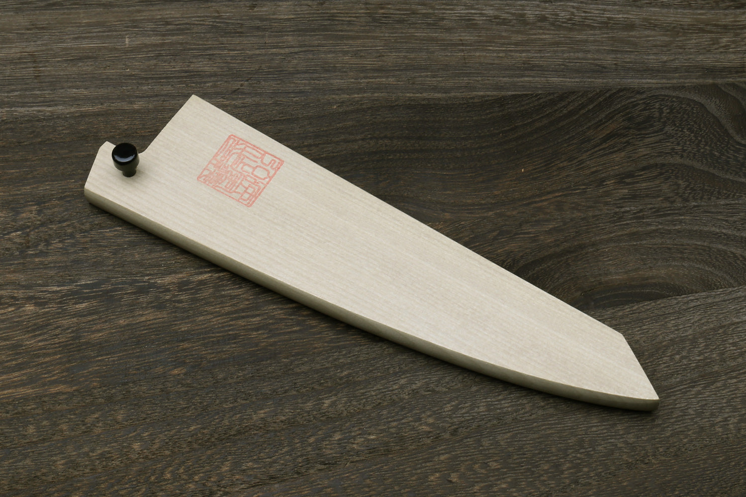 Natural magnolia wood saya cover with black end knob and red logo stamp