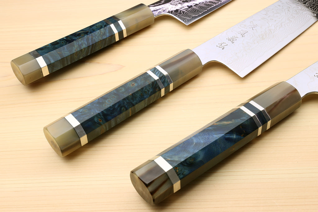 Set of chef knives with ocean blue handles and Damascus-patterned blades