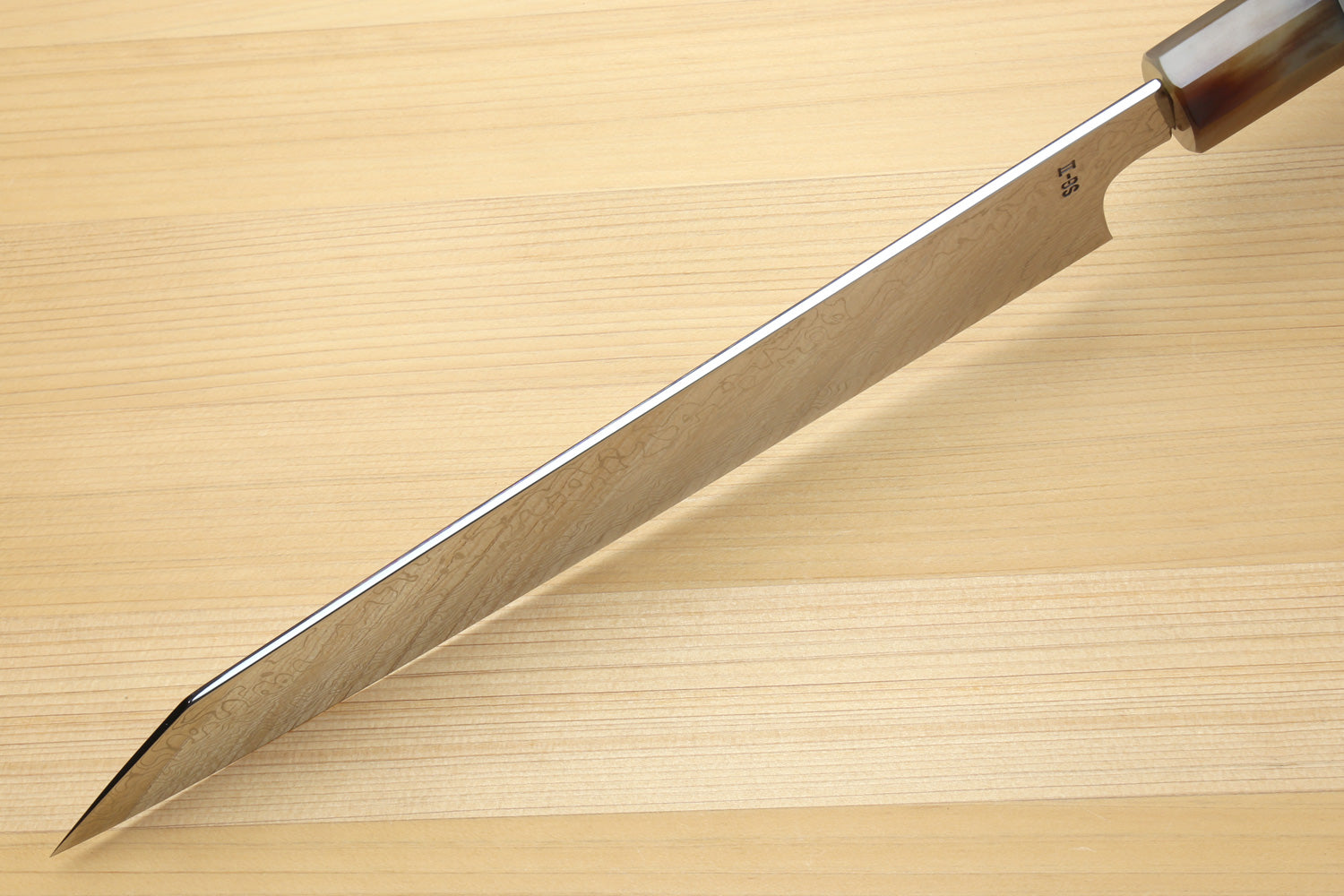 Utility-Kiritsuke chef knife side view with tapered tip and damascus blade
