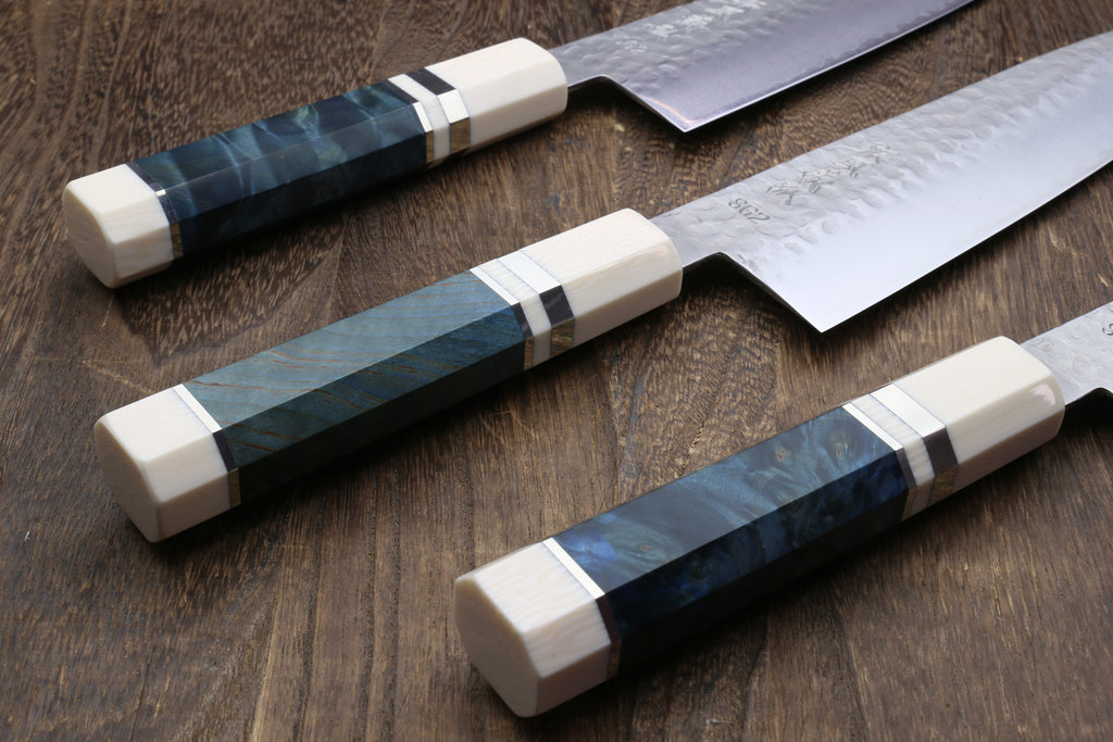 Three hammered stainless gyuto knives with ocean blue stabilized handles