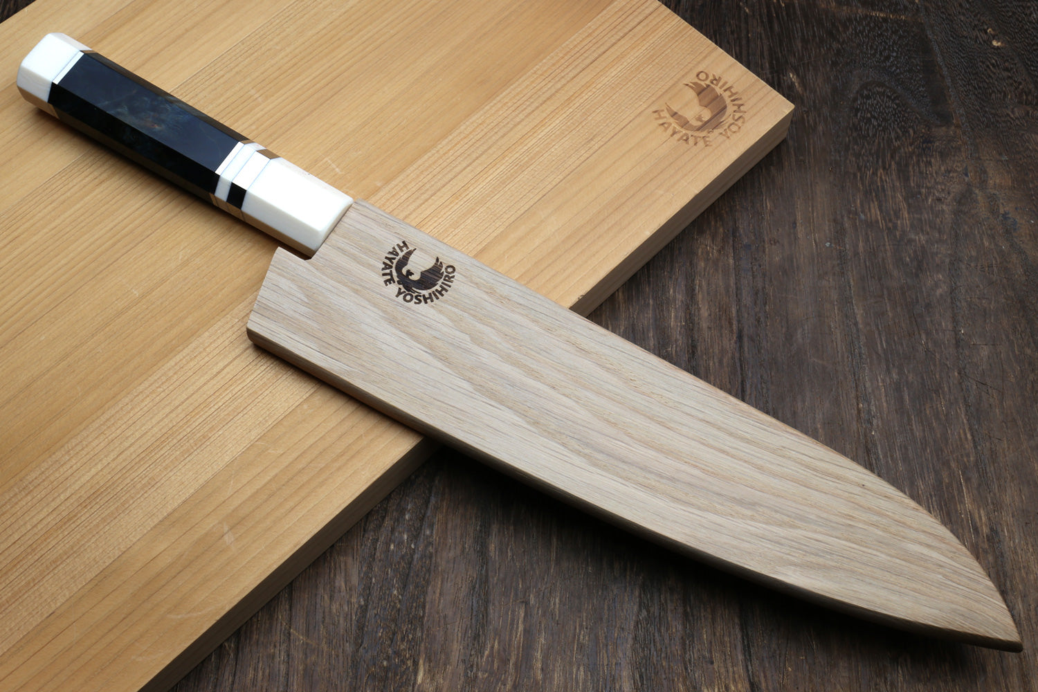 Hammered stainless chef knife with ocean blue handle and white spacer accents