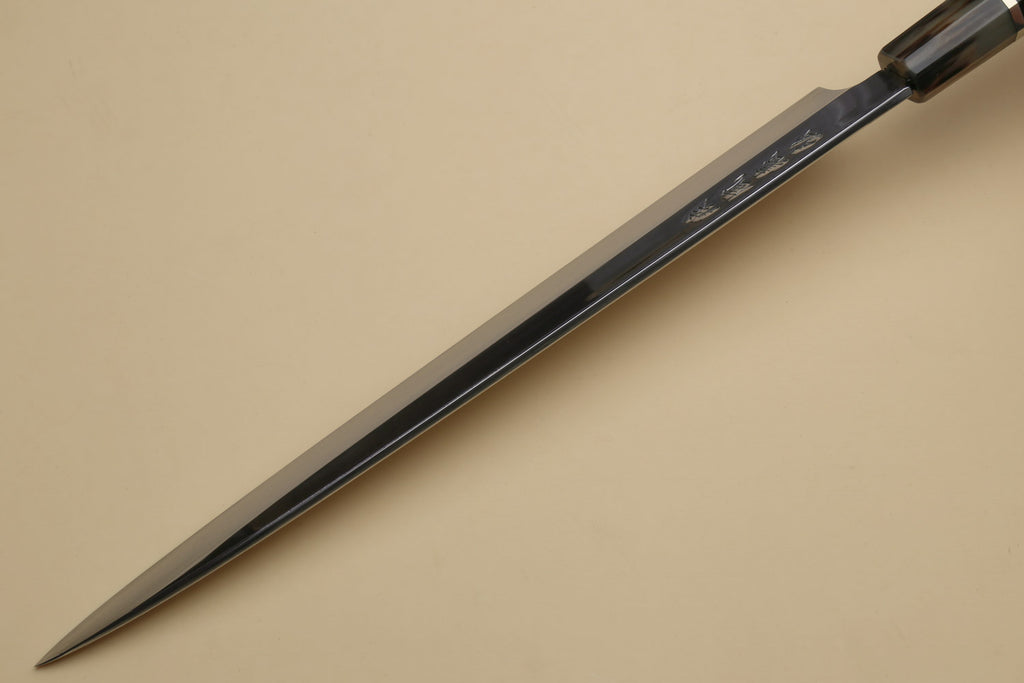 Long yanagi sashimi knife with mirror-polished blade and dark triple-ring ebony handle