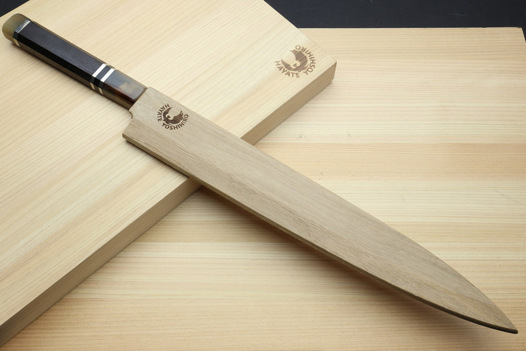 Yanagi sashimi knife with mirror-polished blade and dark triple-ring ebony handle