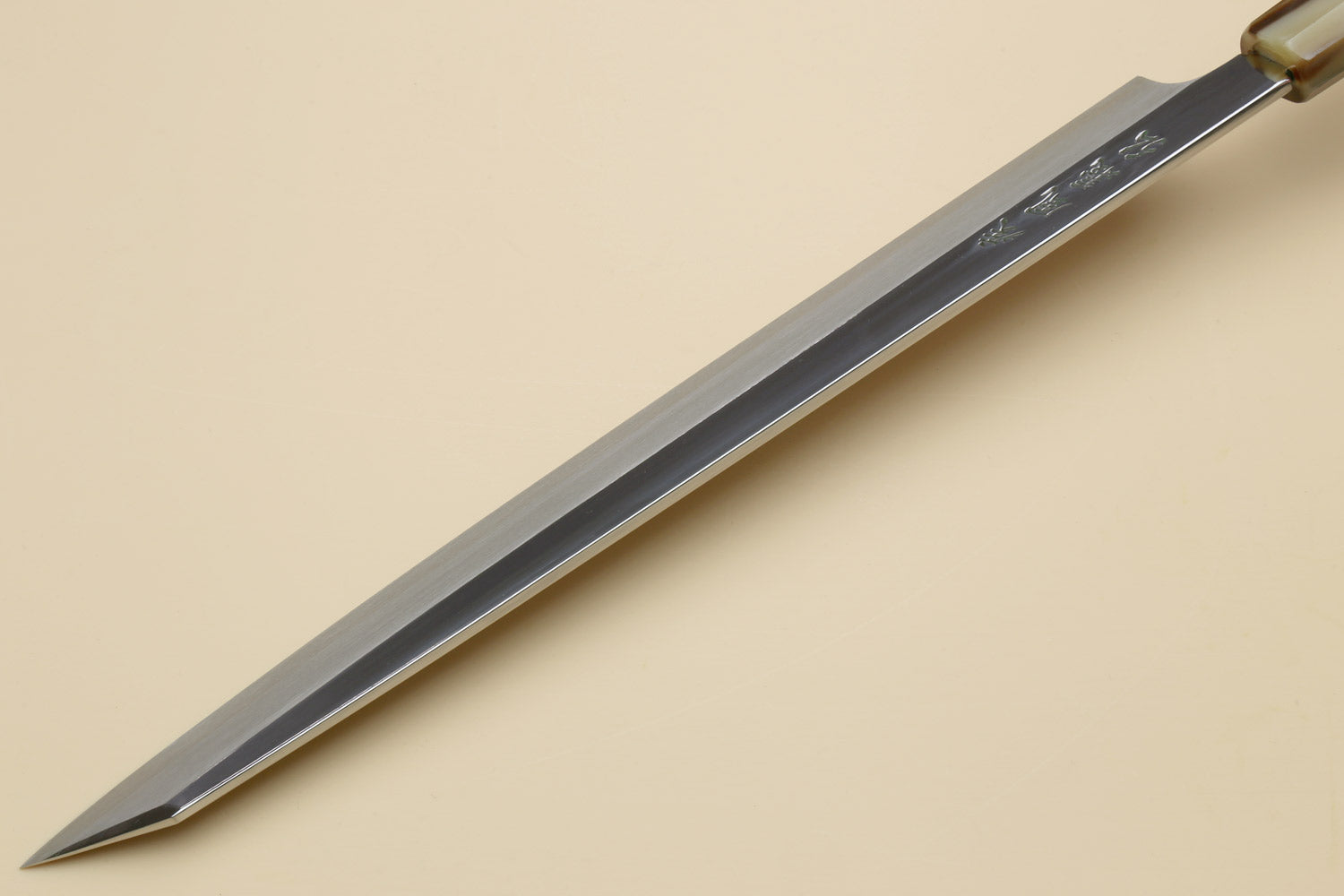 Yanagi kiritsuke knife with pointed tip and dark ebony handle