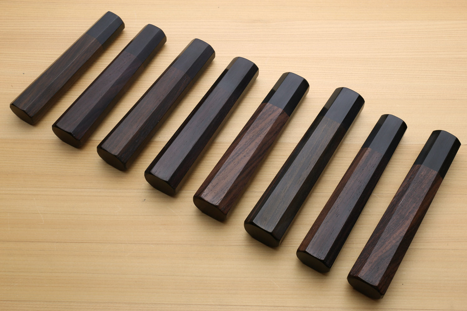 Chef knife handle set: rosewood scales and ebony bolster, angled lineup