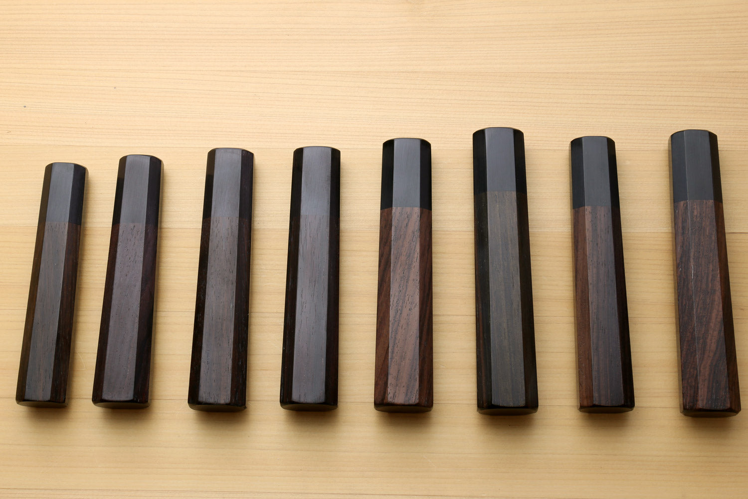 Chef knife handle set with rosewood and dark scales, straight-on lineup