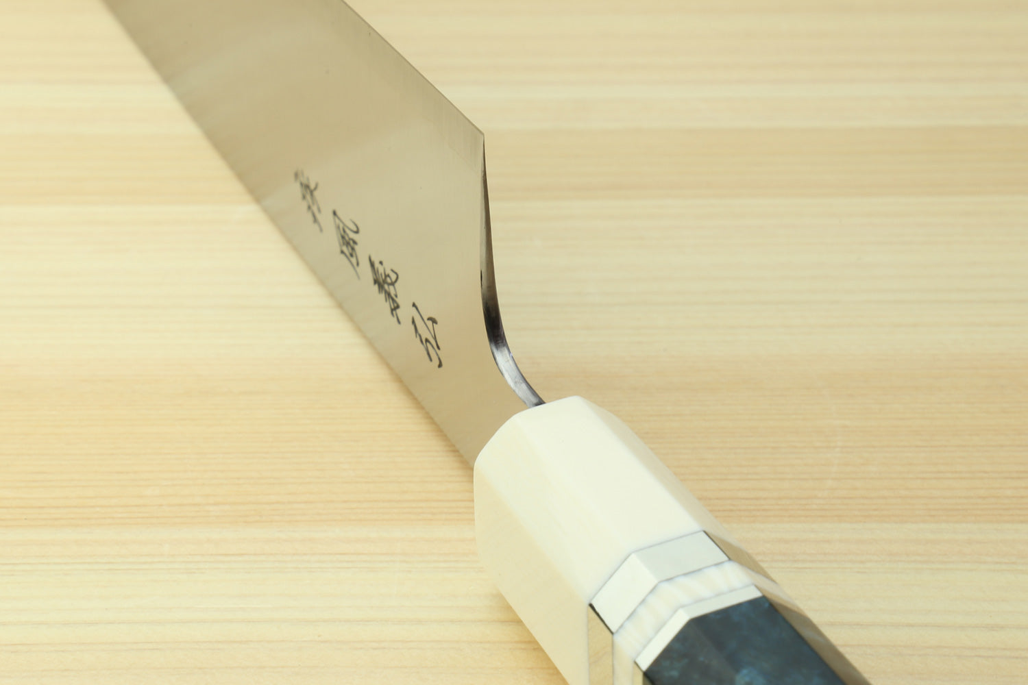 Gyuto chef knife blade and bolster, ivory handle with blue patterned grip