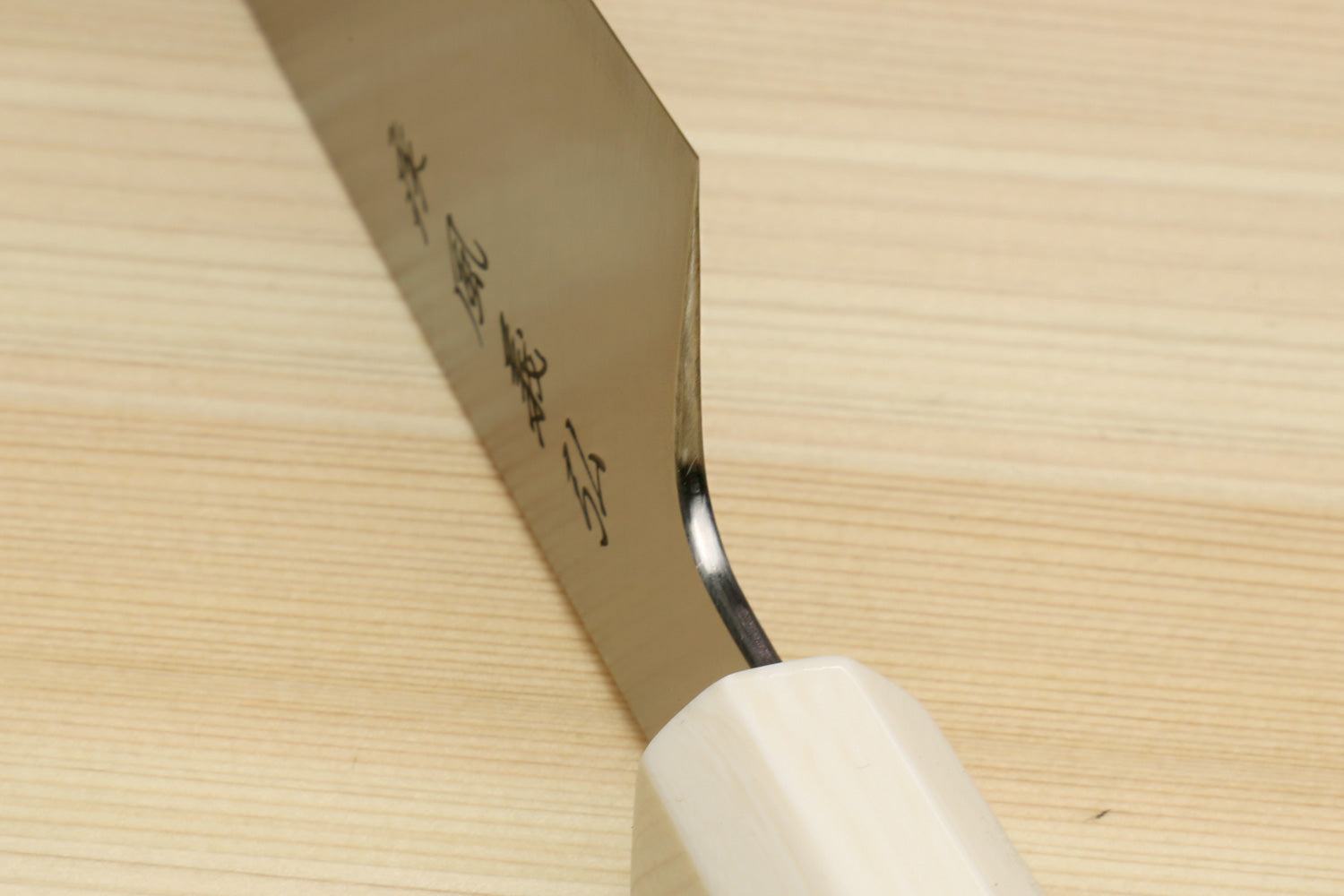 Kiritsuke chef's knife with stainless steel blade and white alternative ivory bolster