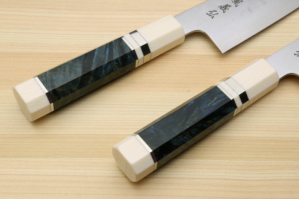 Kiritsuke chef's knife with ocean blue handle scales and white bolster with black accents