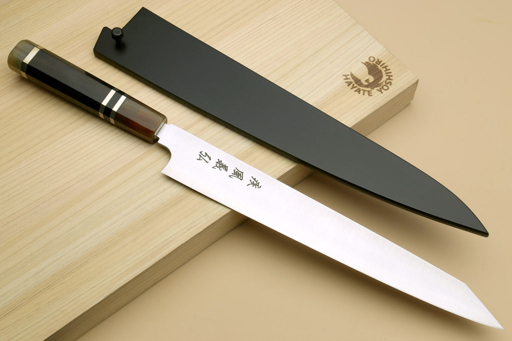 Sujihiki-kiritsuke slicer knife with stainless blade and dark octagonal wood handle