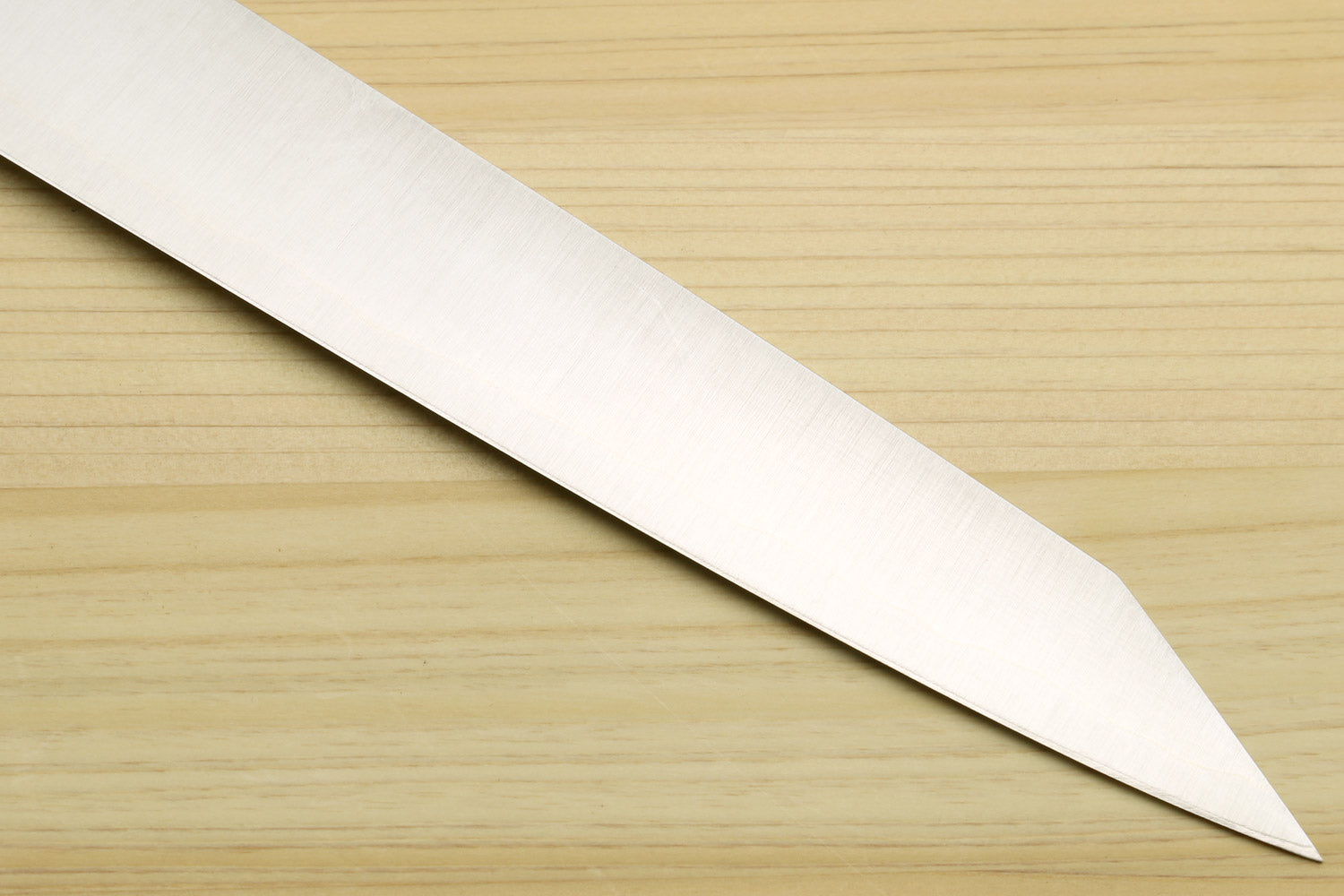 Stainless slicer knife blade close-up with pointed tip and smooth polished edge