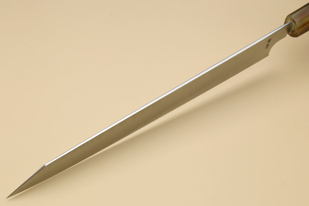 Long stainless slicer knife side view with pointed tip and wooden handle