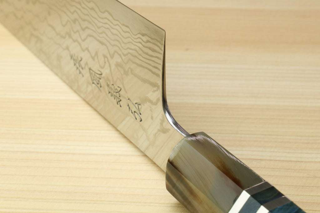 Gyuto chef knife heel close-up with damascus blade and ocean blue handle
