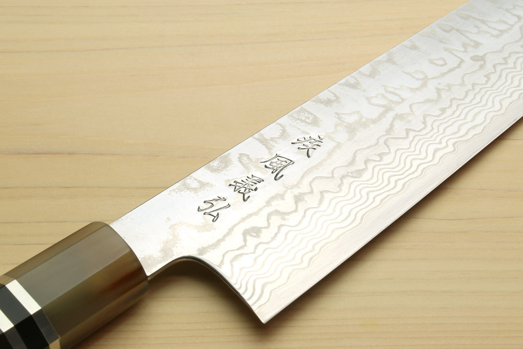 Kiritsuke chef's knife, damascus steel blade with wavy pattern near the heel