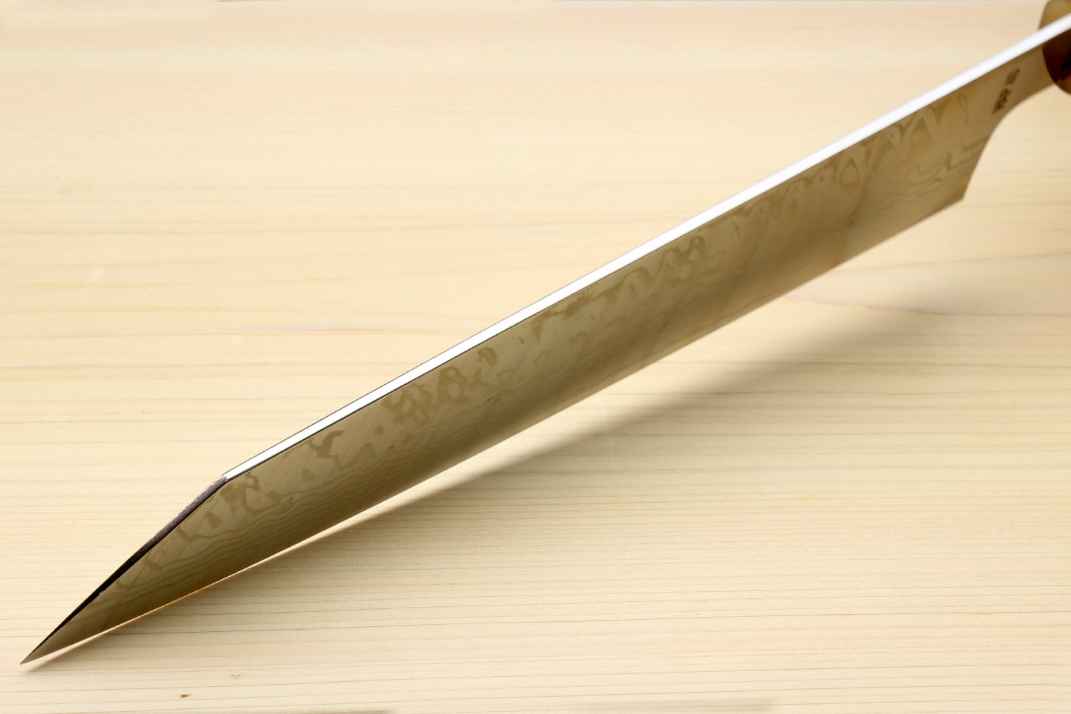 Kiritsuke chef's knife blade side, polished damascus face with sharp point