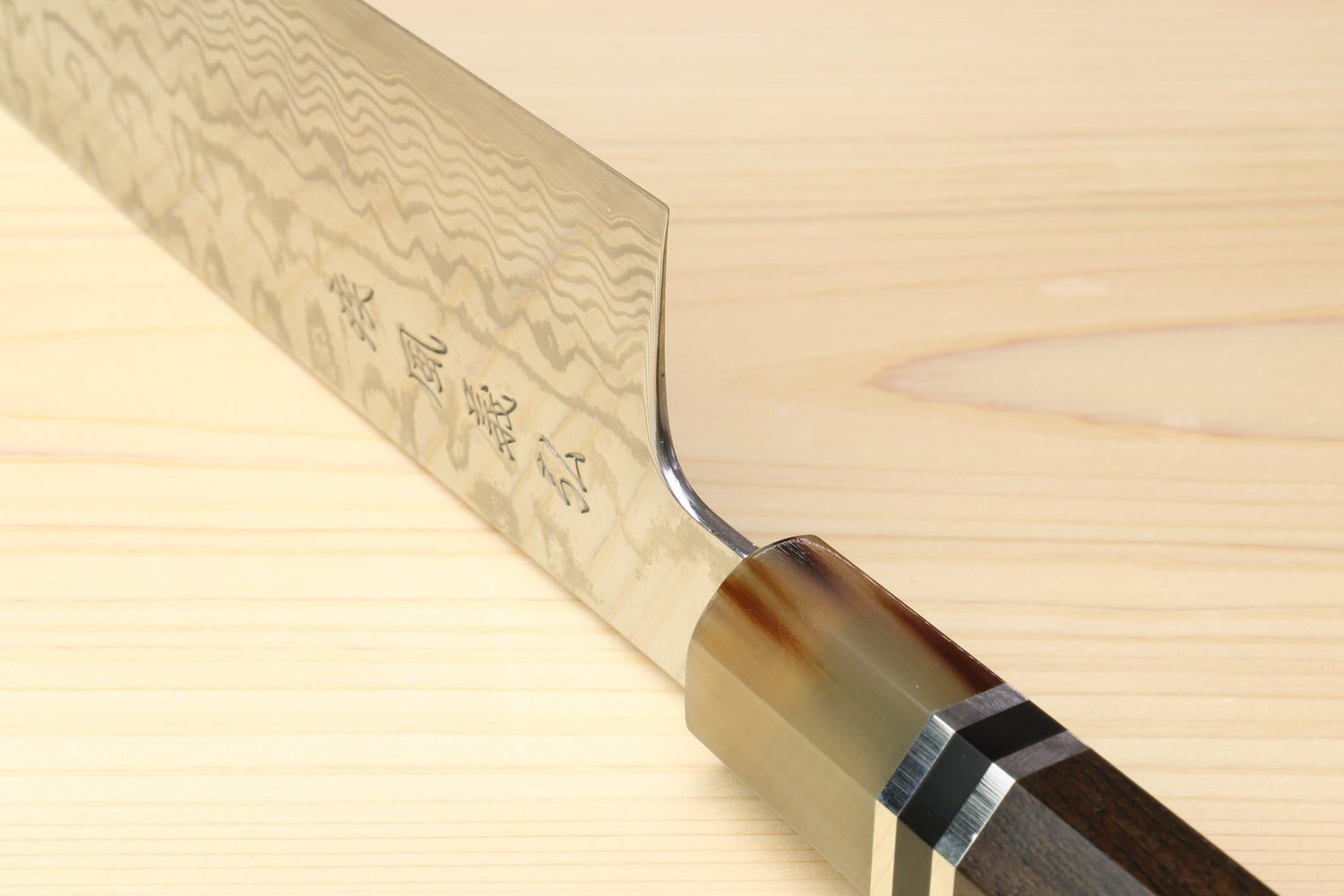 Kiritsuke chef's knife, damascus blade with octagonal ebony handle and dark bands