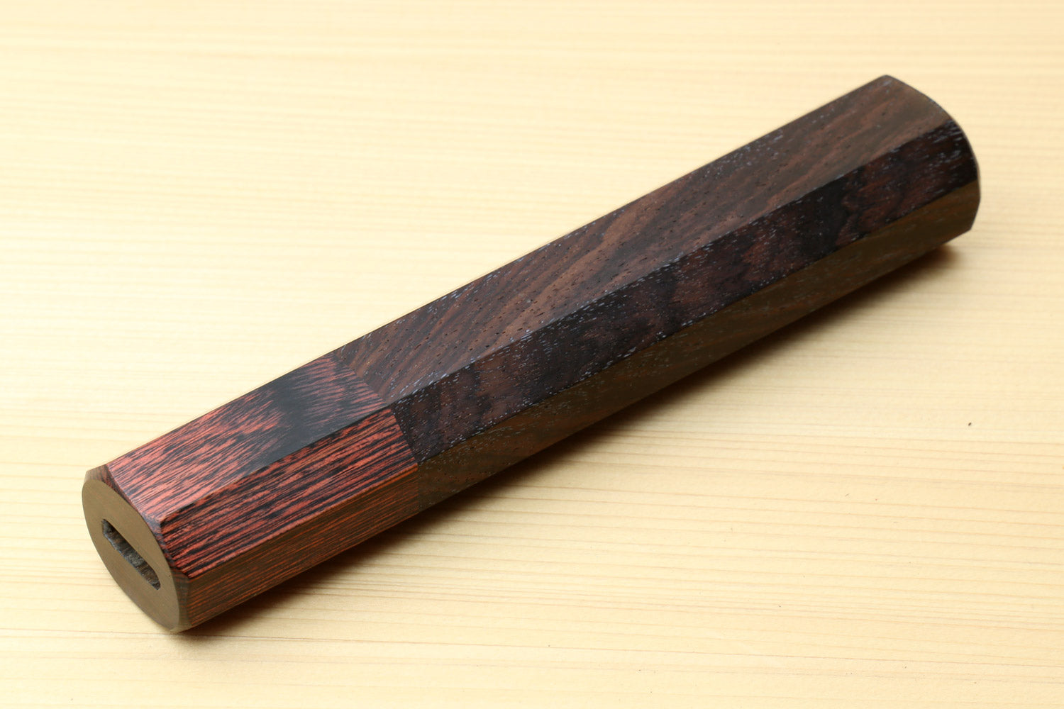 Rosewood handle with dark mahogany bolster and oval lanyard hole