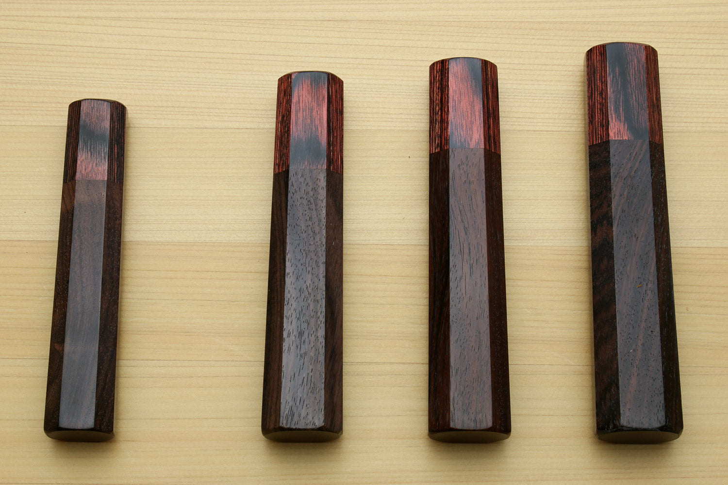 Set of rosewood handles with mahogany bolster and oval lanyard holes