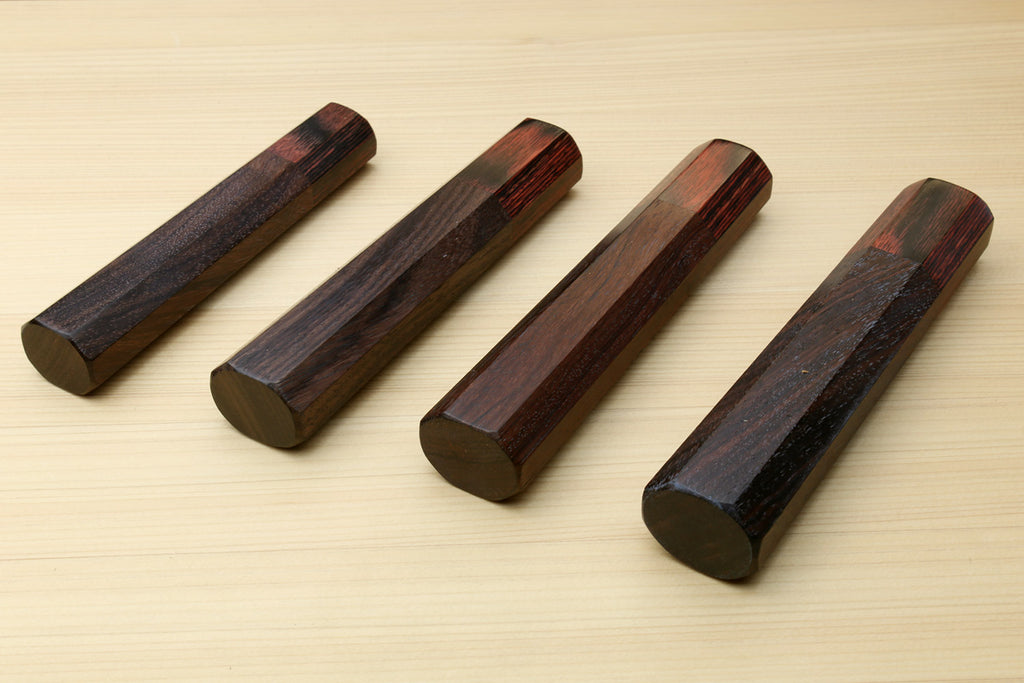 Four rosewood handle pieces with mahogany bolsters and end lanyard holes