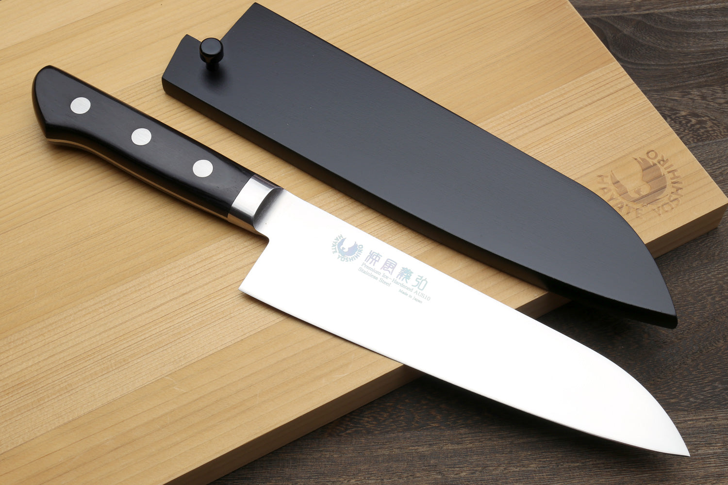 Santoku chef’s knife with matching blade cover (saya) and black handle with white dots