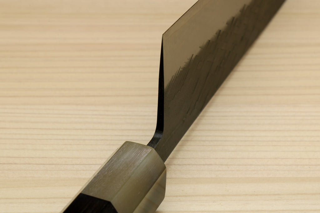 Kiritsuke chef knife handle and bolster, dark wood grip and hammered blade spine