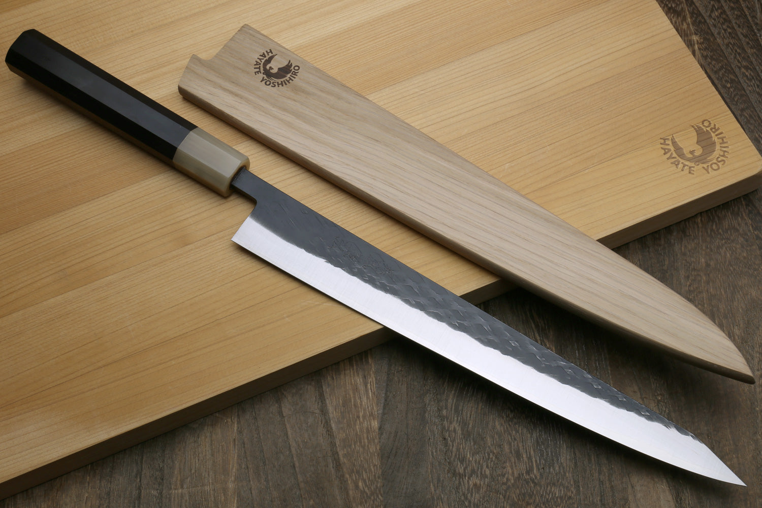Sujihiki slicer knife with black handle and wooden saya cover
