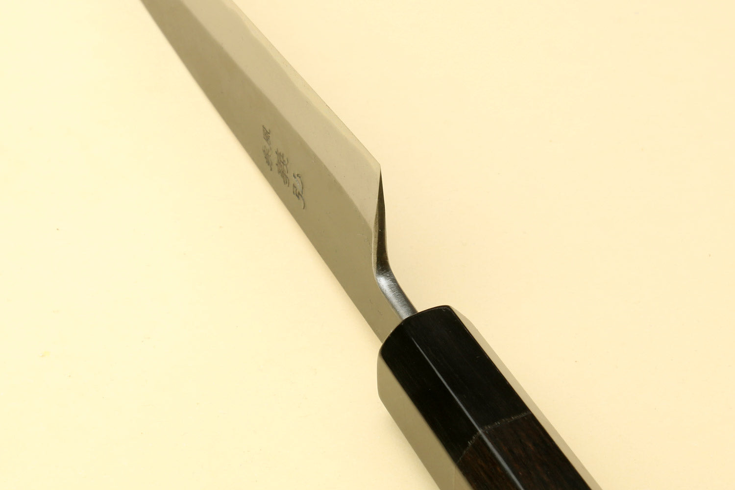 Yoshihiro Kurouchi petty utility knife close-up of blade tip and dark handle