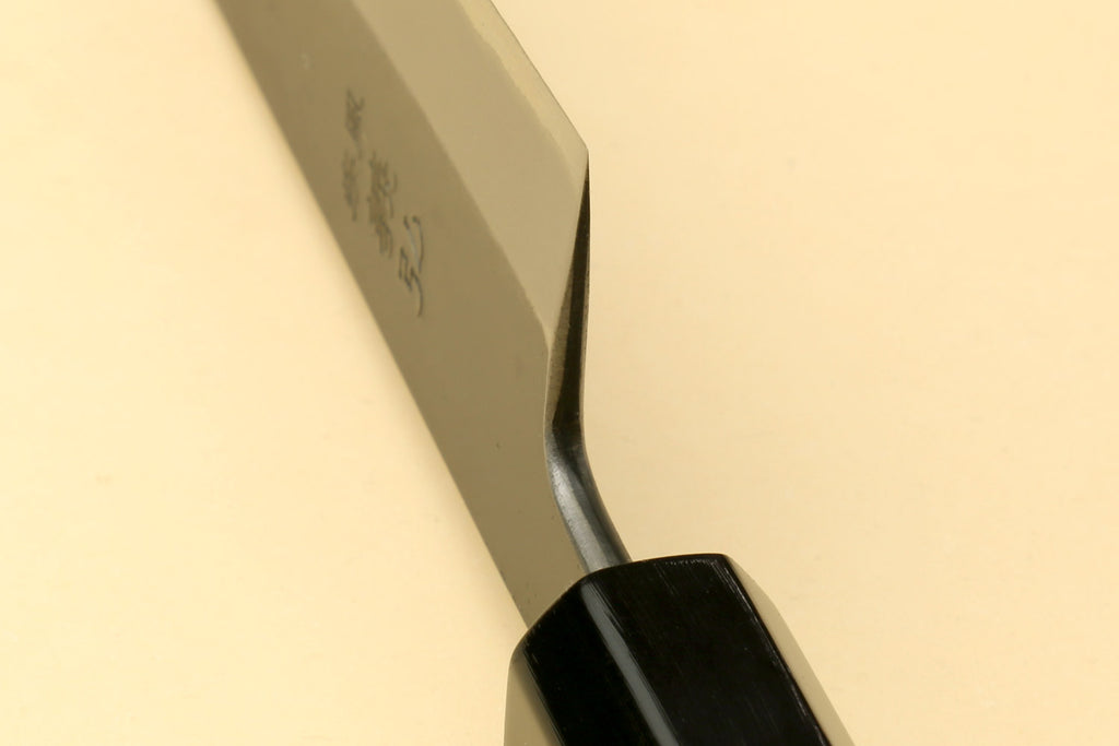 Petty-kiritsuke knife heel and ebony handle end, blade markings visible