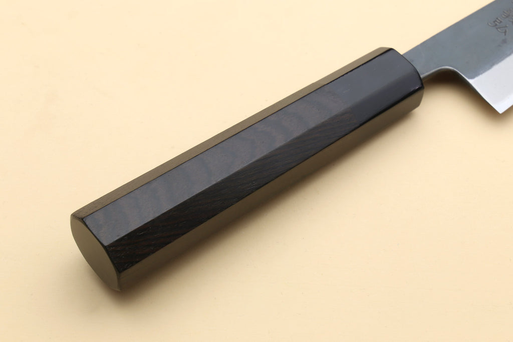 Ebony wood knife handle with smooth dark scales, fitted to a stainless blade