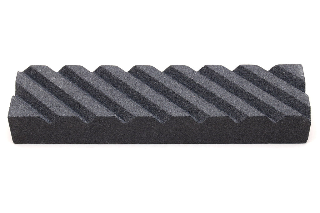 Sharpening stone fixer, black ribbed wedge block with stepped ridges