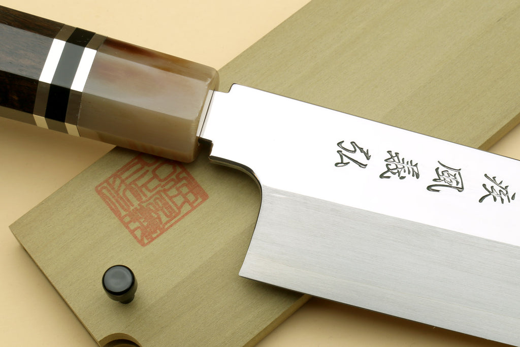 Kiritsuke Japanese knife with mirror blade, etched characters, and ebony triple-ring handle