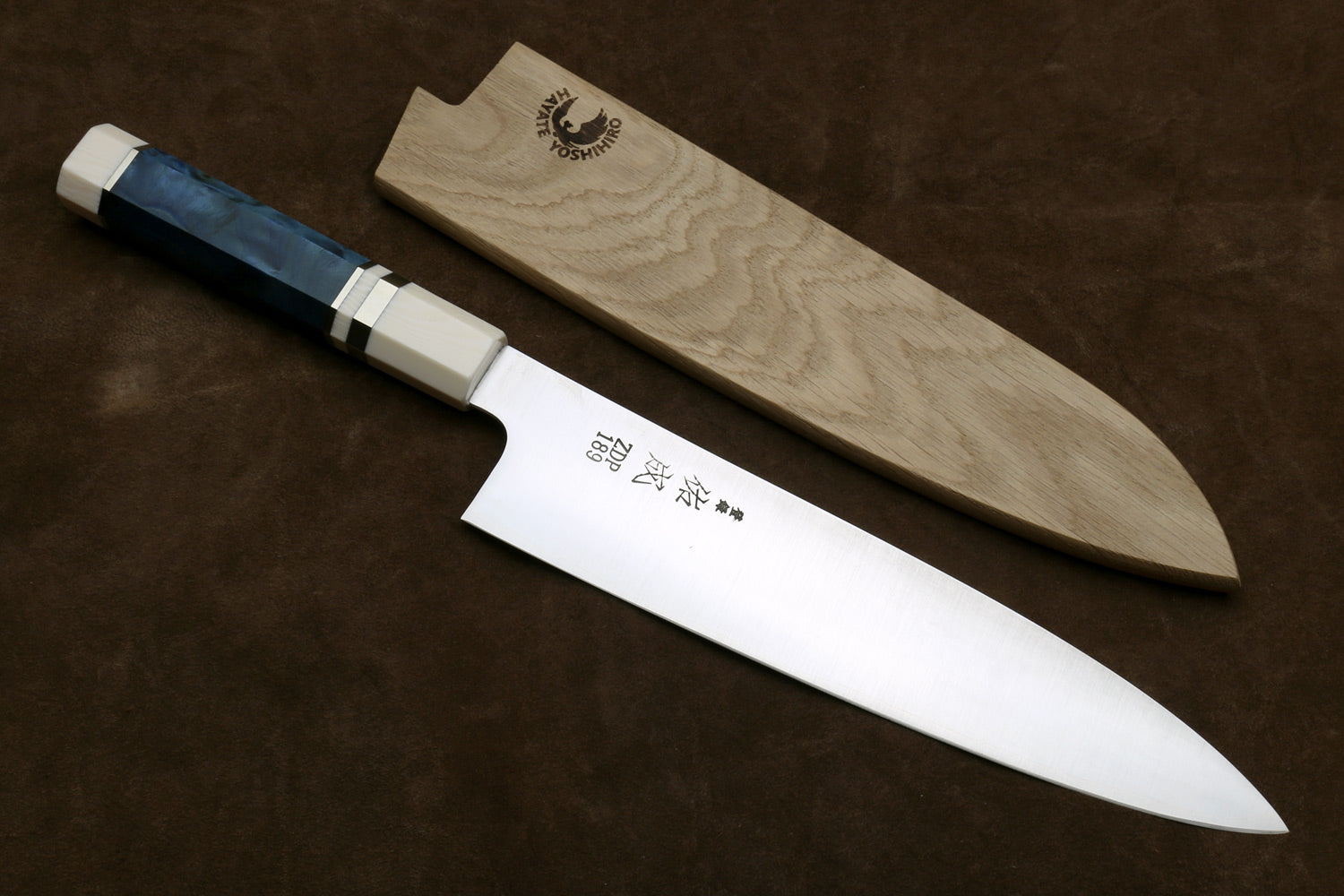Gyuto chef knife with stainless blade, ivory bolster, octagonal blue handle