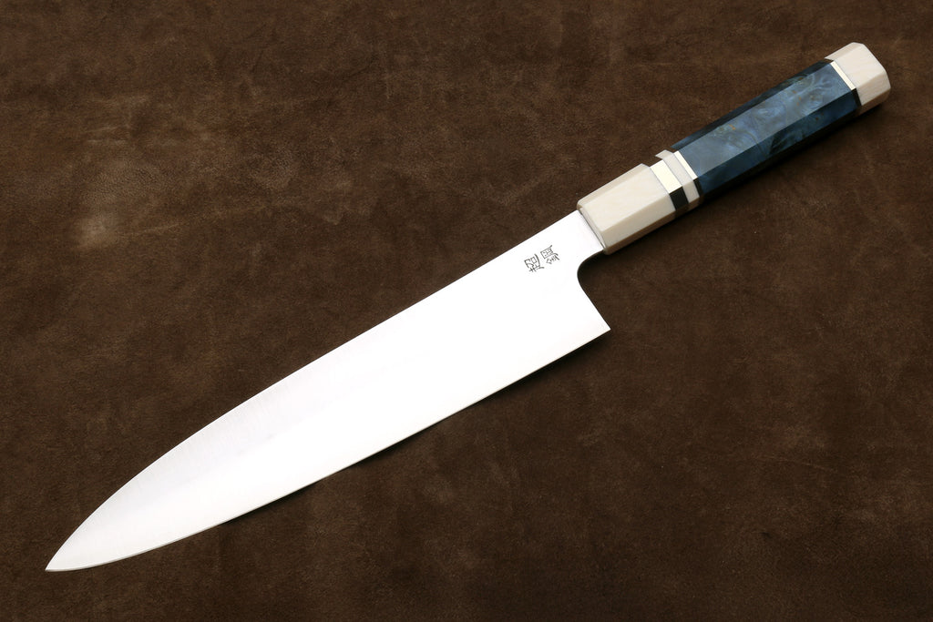 Side view gyuto chef knife with stainless blade, ivory bolster, blue octagonal handle