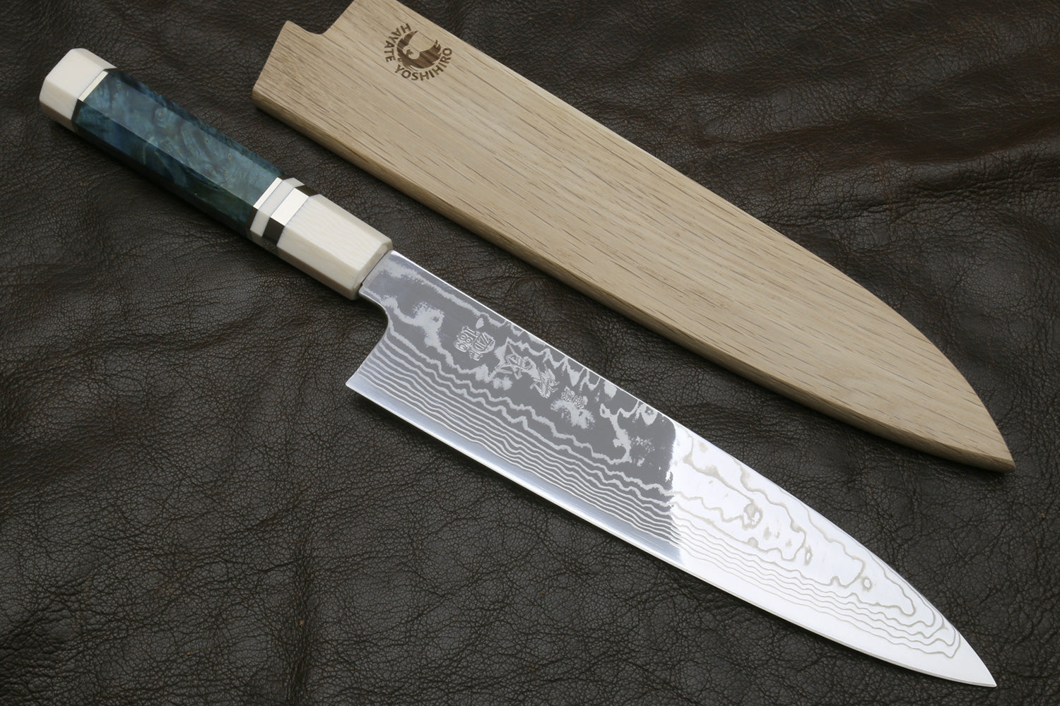Damascus gyuto chef knife with ivory octagonal handle, teal bolster, and patterned blade