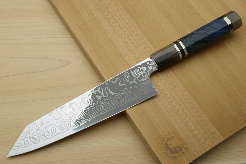 Damascus kiritsuke chef knife with blue octagonal handle, shown in side view