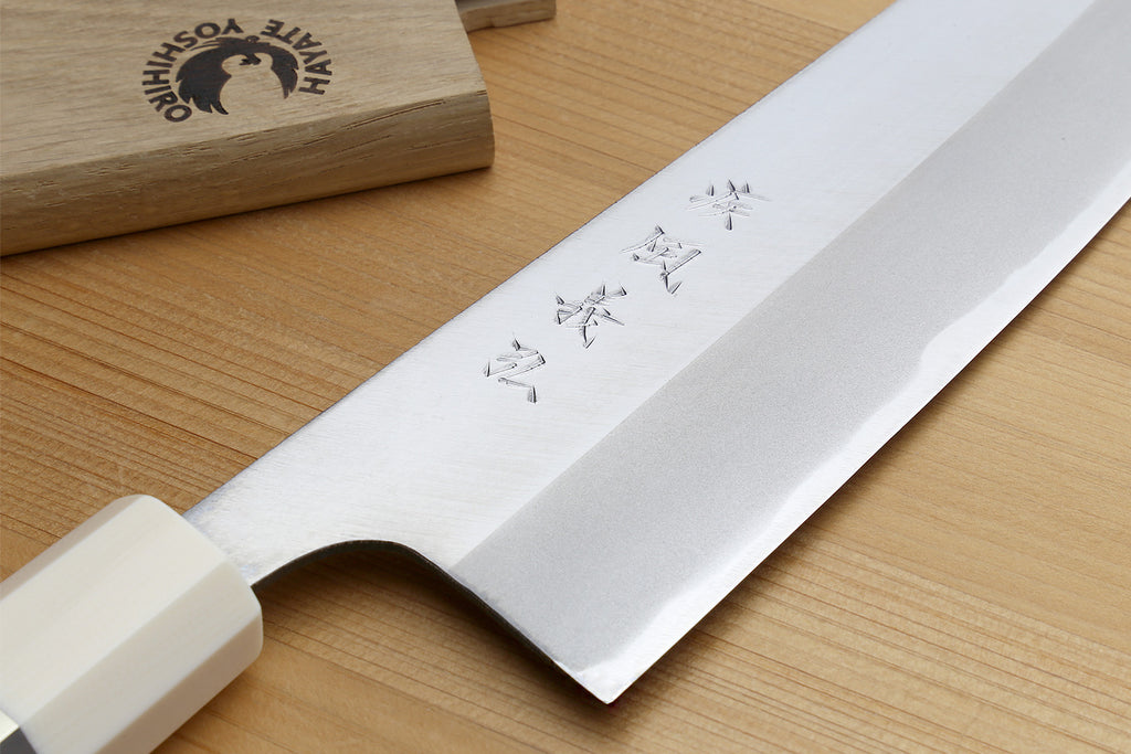 Japanese chef knife, silver blade with etched pattern near tip