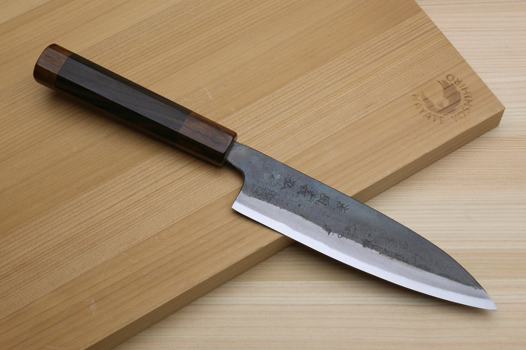Petty utility knife with dark ebony handle and blue-gray kurouchi steel blade