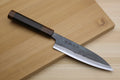 Petty utility knife with dark ebony handle and blue-gray kurouchi steel blade