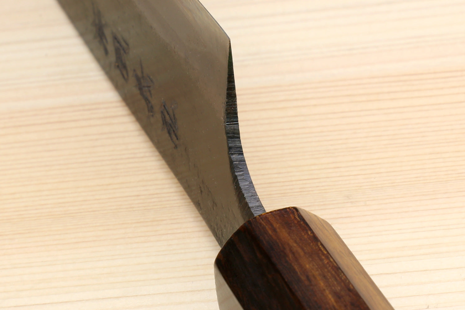 Utility knife tip and bolster with dark blade and wooden handle