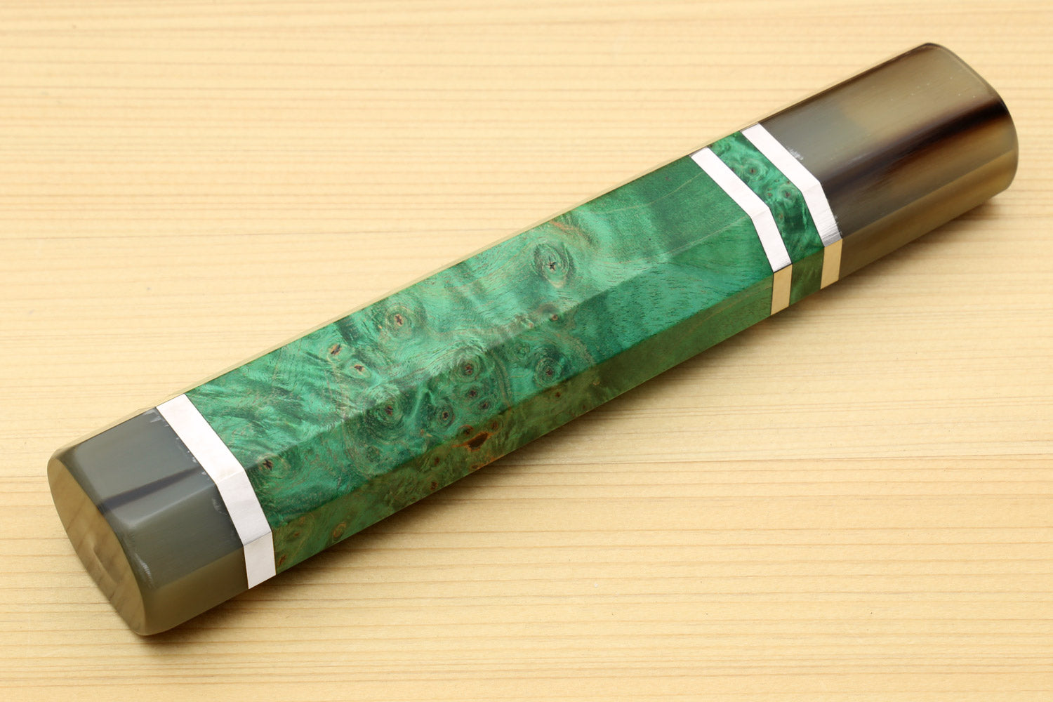Green stabilized maple burl knife handle with horn bolster and white stripe wrap