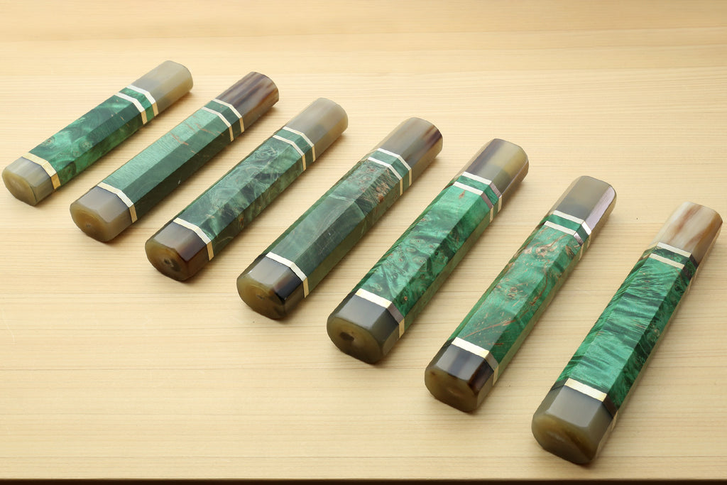 Stabilized maple burl knife handle, green with horn bolster and white striped wrap