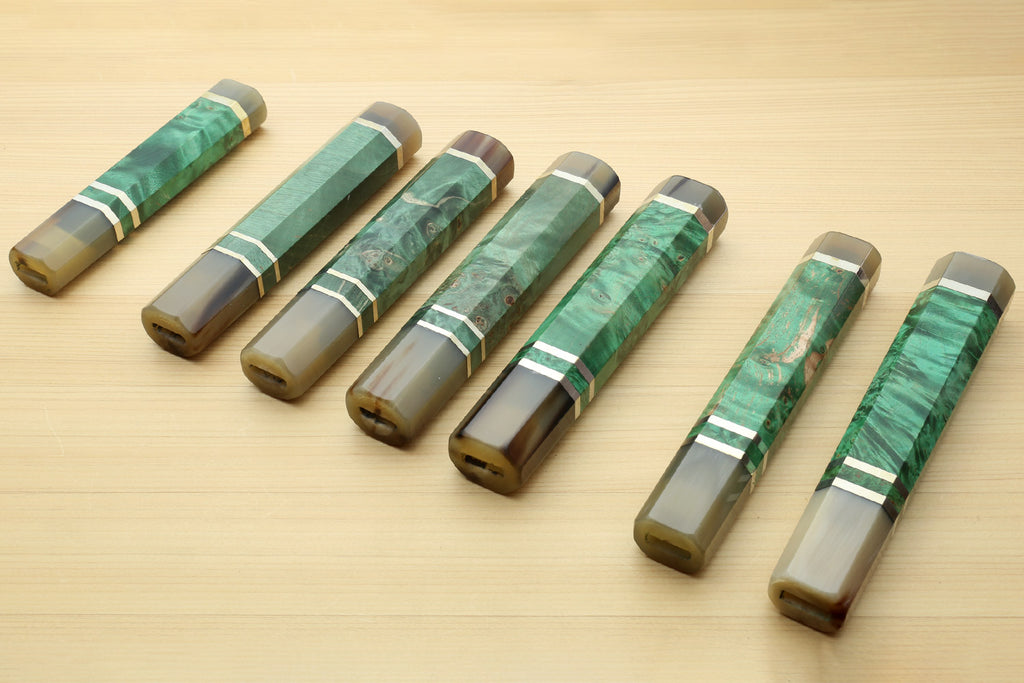 Assorted green burl knife handles with horn bolsters and white striped collar bands