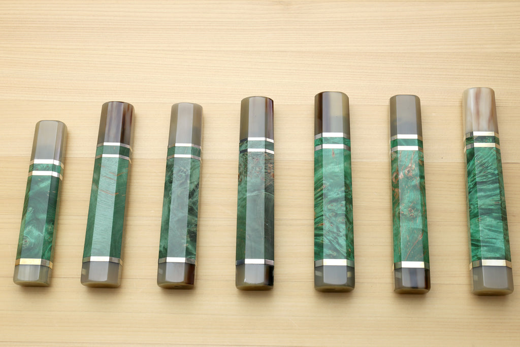 Set of green stabilized burl knife handles with horn bolsters and white striped collars
