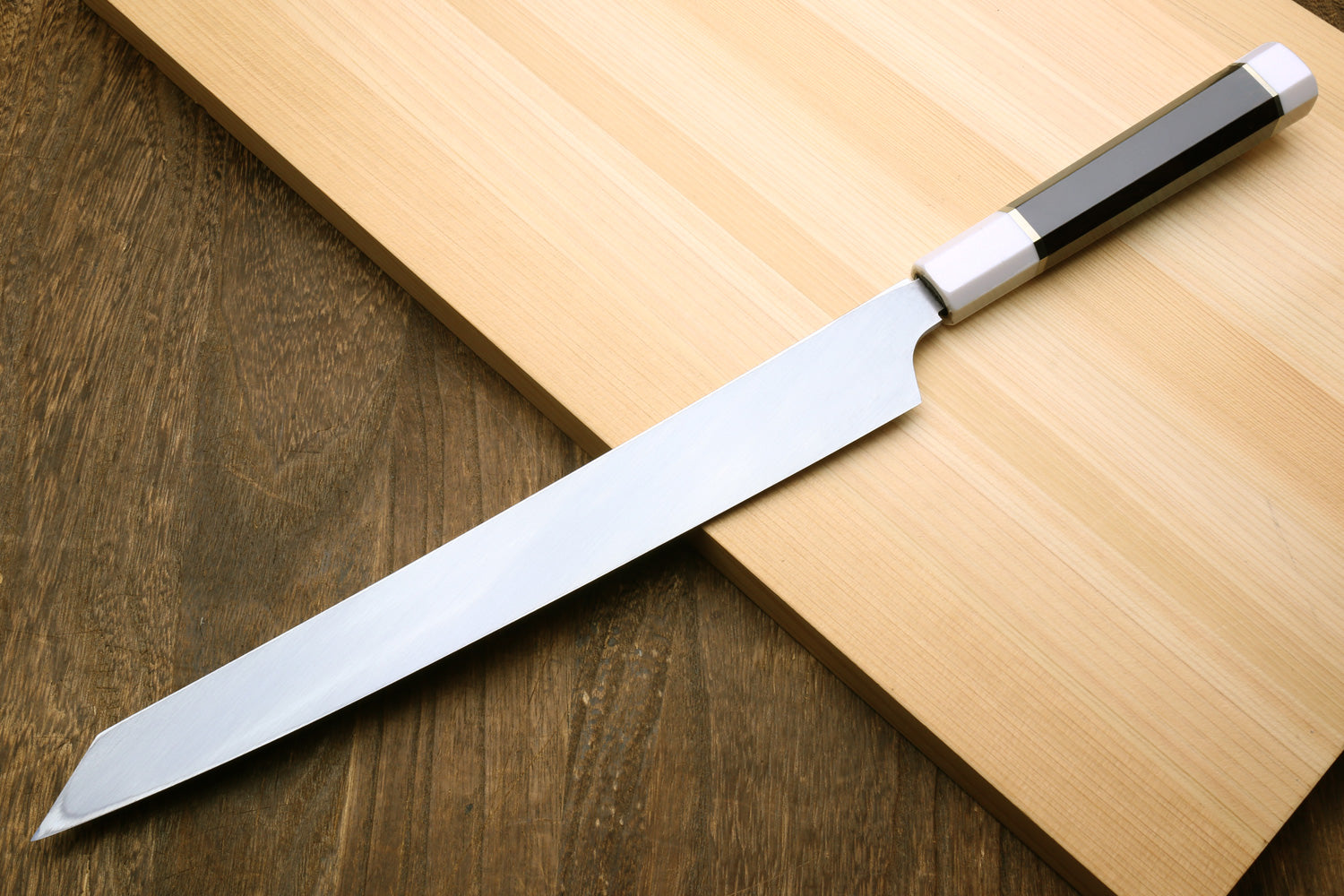 Japanese yanagi sushi knife with silver ring and dark ebony handle