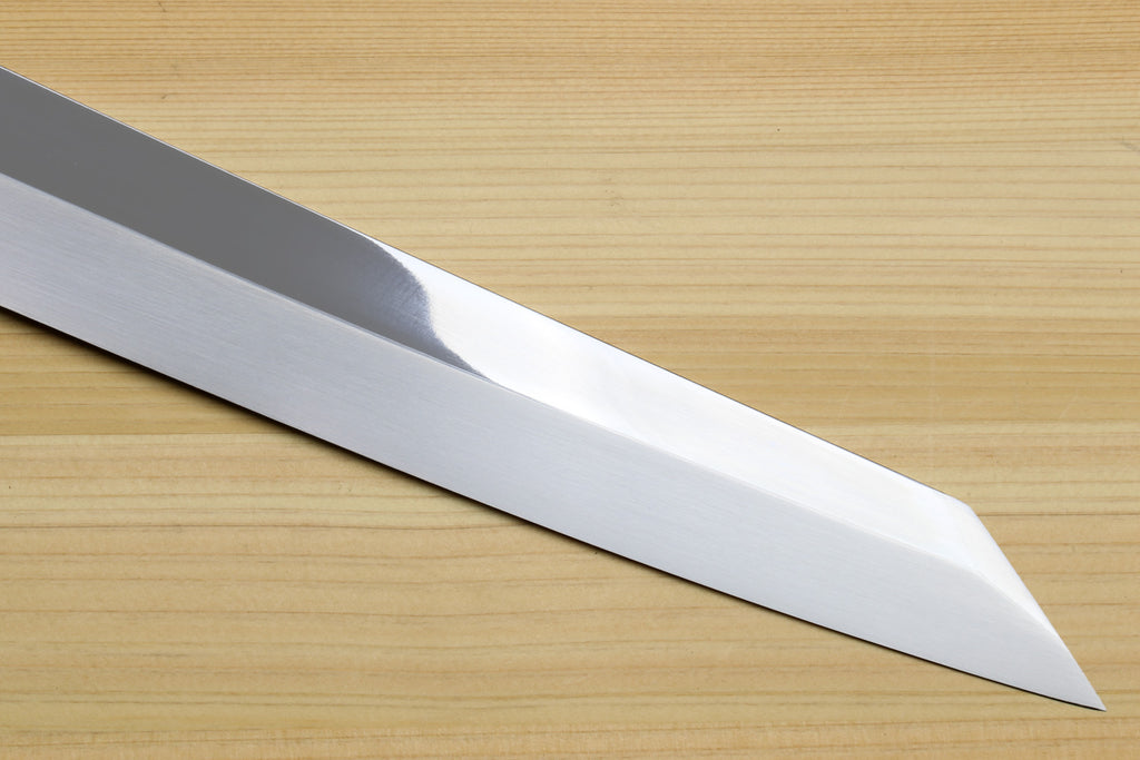 Japanese yanagi sushi knife blade close-up, polished steel with pointed tip